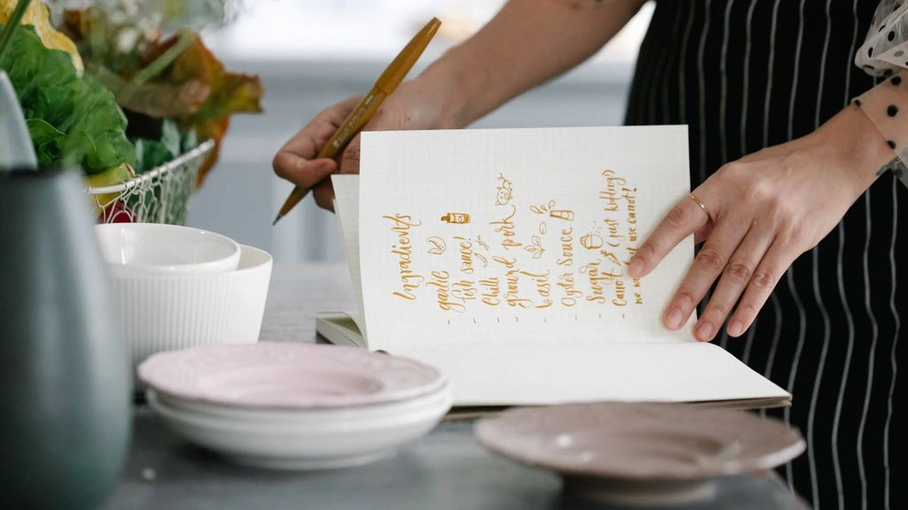 Handwritten note on cotton paper tucked inside a kraft gift box